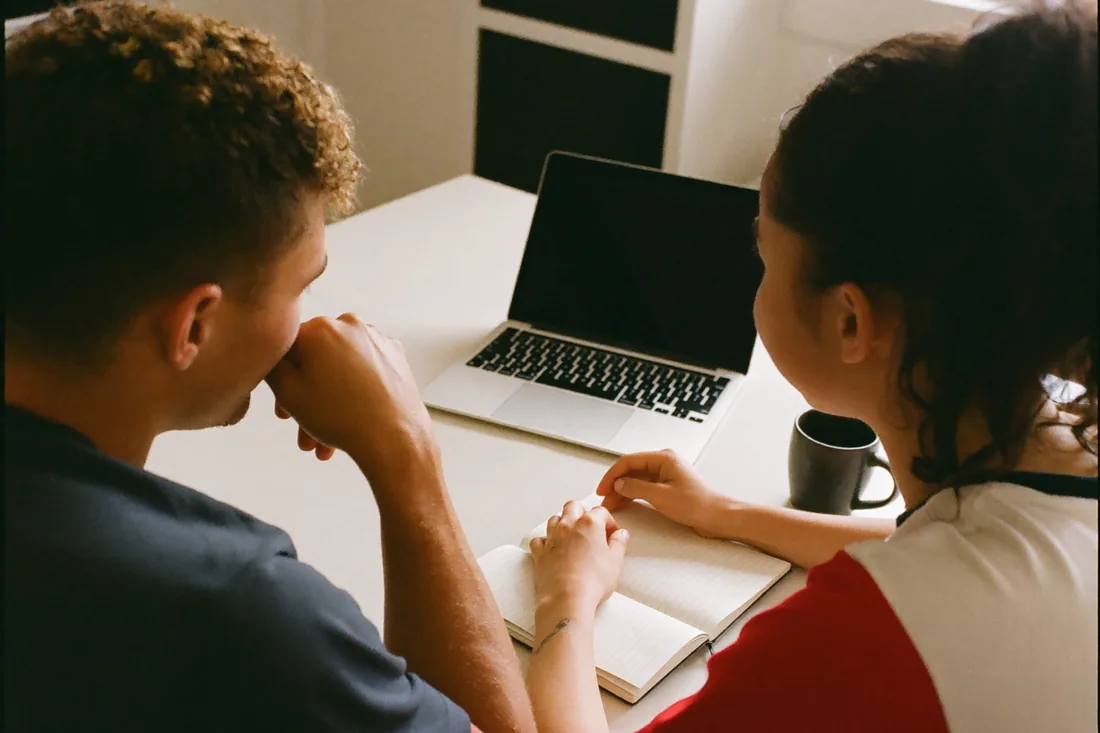 Australian first home buyers reviewing their budget at home to work out how much they can borrow.