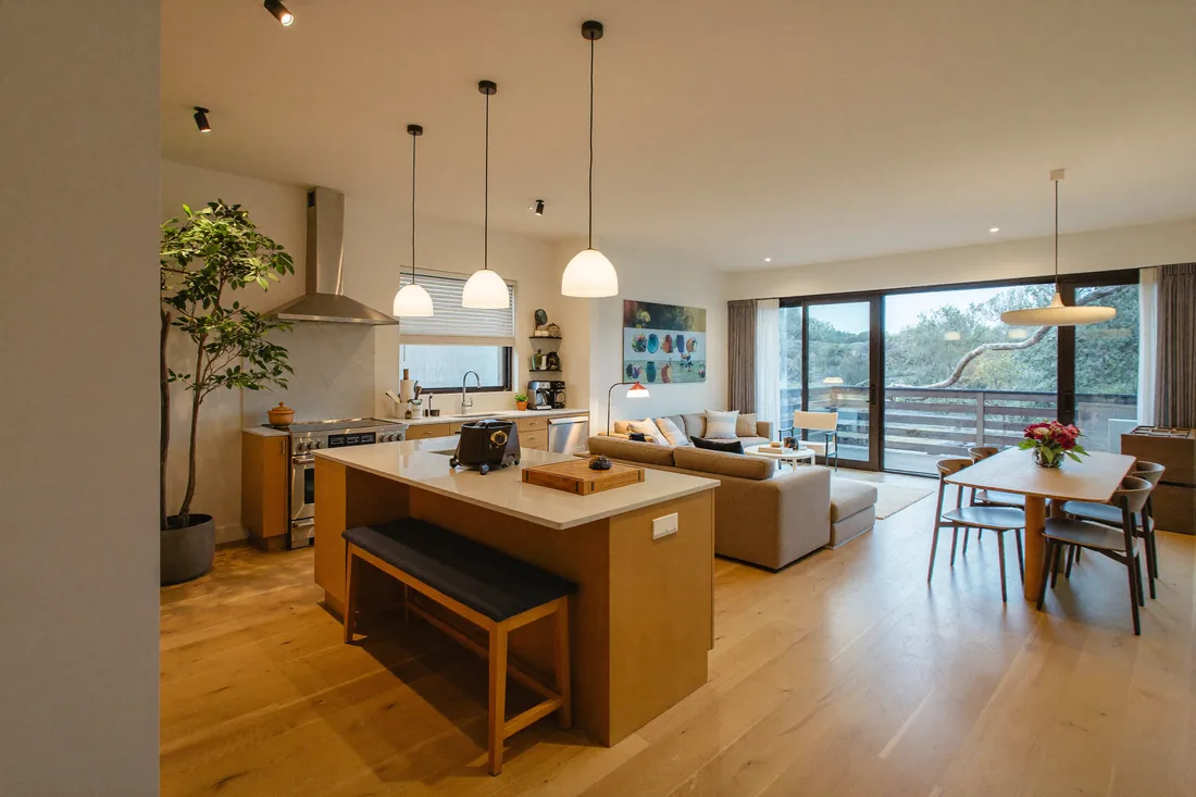 The bright open-plan kitchen and living area inside a modern Australian granny flat, the kind of self-contained second dwelling that can be rented out for $400 to $600 a week in 2026.