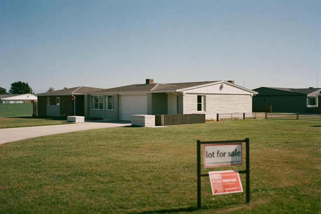 A newly built single-storey house and land package home on a turfed lot in an Australian outer-suburban growth estate.