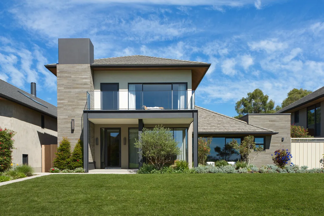 An Australian residential investment property with a manicured front lawn, the kind of non-owner-occupied land that attracts annual state land tax above the threshold.