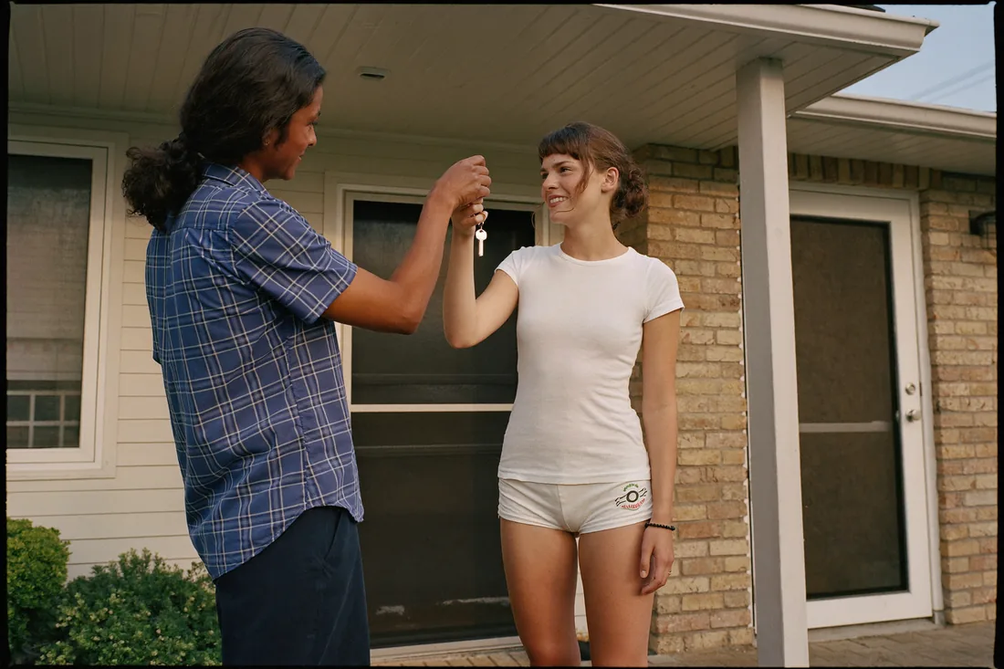 A real estate agent handing house keys to a first home buyer after settlement completes in Australia.
